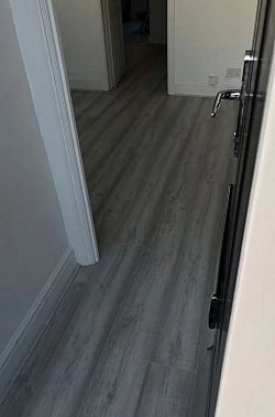 Belfast Oak Laminate Flooring. Supply and installed the finish has grey synchronised colour matching  Scotia beading, Halton, Merseyside, Runcorn, Cheshire areas are available
