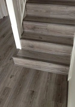 Laminate flooring on stairs installation | showcasing colour matching accessories | Flooring near me