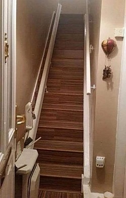Foxwood flooring laminate installation to stairs (with chair lift), showcasing matching accessories and a professional floor fitting | flooring near me supply laminate flooring
