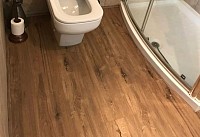 Can you install laminate over ceramic tiles?